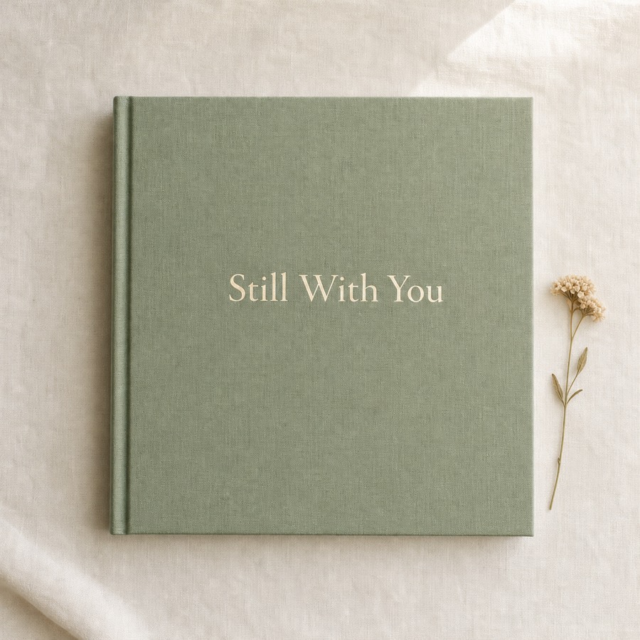 The Stillwith memorial book — sage linen hardcover with foil title
